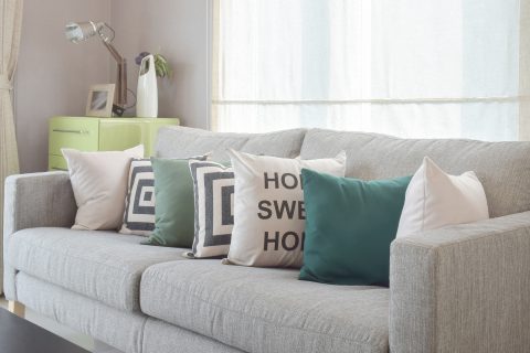 Grey Couch With Colorful Pillows In A Living Room
