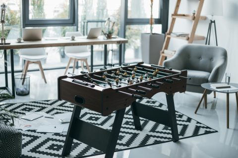Close-up view of foosball table in modern office interior